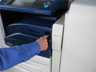 Power off the printer and unplug it from the power source.
Locate the encoder strip, a clear plastic strip that runs horizontally across the printer.
